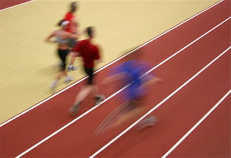 female triathlon - Motion blurred athletes competing on the track Stock Photo - Budget Royalty-Free & Subscription, Code: 400-04064304