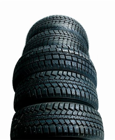 pile tires - Brand new tires stacked up and isolated on white background - worms view Stock Photo - Budget Royalty-Free & Subscription, Code: 400-04064321