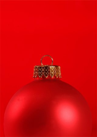 simsearch:400-04776576,k - Macro of a red ornament isolated agains a red background Stock Photo - Budget Royalty-Free & Subscription, Code: 400-04064381