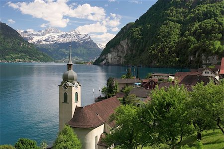 Looking over the church in Bauen onto Lake Lucerne in Switzerland. Stock Photo - Budget Royalty-Free & Subscription, Code: 400-04064512