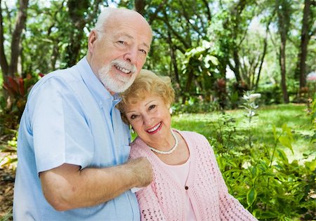 simsearch:400-04109826,k - Loving senior couple outdoors in a beautiful natural setting.  Plenty of room for text. Fotografie stock - Microstock e Abbonamento, Codice: 400-04065018
