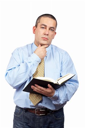 simsearch:400-04963726,k - Serious business man thinking and holding one book over a white background Stock Photo - Budget Royalty-Free & Subscription, Code: 400-04065071