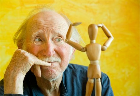 simsearch:400-04065514,k - Elderly Artist Ponders a Wooden Figure Model Foto de stock - Super Valor sin royalties y Suscripción, Código: 400-04065511