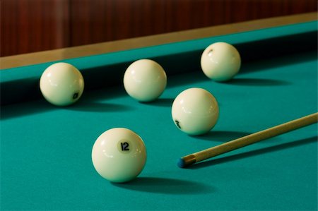 simsearch:400-04478467,k - Five white billiard-balls and a wood cue on a green table Stock Photo - Budget Royalty-Free & Subscription, Code: 400-04065954