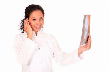 dead_morozzzka (artist) - smiling doctor with an x-ray calling by phone over white background Photographie de stock - Aubaine LD & Abonnement, Code: 400-04066222