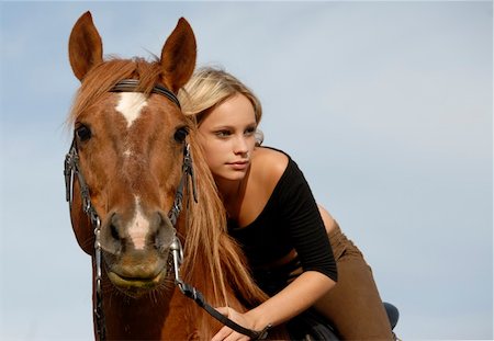 simsearch:400-04660370,k - blond teenager and her brown horse in blue sky Photographie de stock - Aubaine LD & Abonnement, Code: 400-04066945