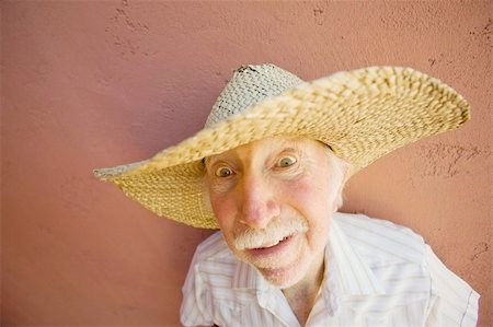 funny old men crazy - Crazy man in a big straw hat Stock Photo - Budget Royalty-Free & Subscription, Code: 400-04067304