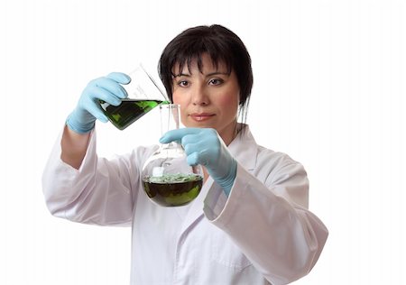 simsearch:400-04962353,k - A scientist pouring chemical into a round flask. Stock Photo - Budget Royalty-Free & Subscription, Code: 400-04067525