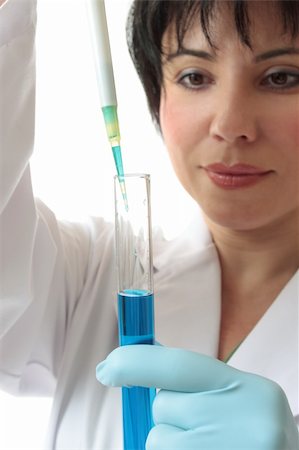 simsearch:400-04962353,k - Female scientist at work in laboratory using a pipette and test tube.  Focus to pipette and test tube. Stock Photo - Budget Royalty-Free & Subscription, Code: 400-04067527