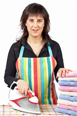 simsearch:400-04019890,k - A housewife in apron holding a eletric iron close to towels stacked Stock Photo - Budget Royalty-Free & Subscription, Code: 400-04067530