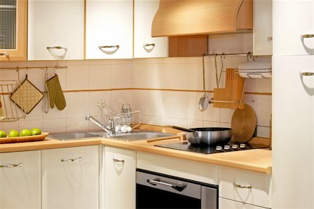 simsearch:400-05132663,k - Modern kitchen counter with wooden details and pot Stock Photo - Budget Royalty-Free & Subscription, Code: 400-04067578