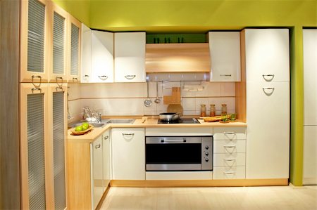 simsearch:659-06373243,k - Modern wooden kitchen counter with big cabinet Foto de stock - Super Valor sin royalties y Suscripción, Código: 400-04067579