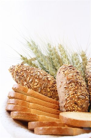 Assortment of baked bread with wheat isolated on white background Stock Photo - Budget Royalty-Free & Subscription, Code: 400-04067611
