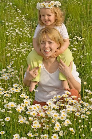 simsearch:400-04204275,k - Happy laughing little girl with her mother on the flowers field Foto de stock - Super Valor sin royalties y Suscripción, Código: 400-04067651