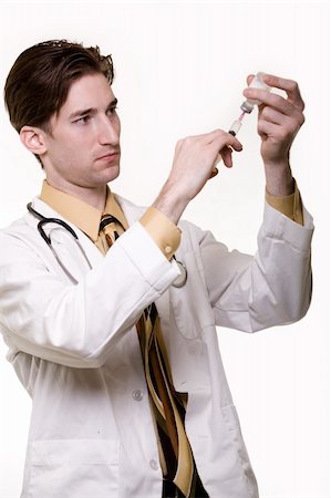 Handsome young male doctor filling up a syringe to give injection over white Stock Photo - Budget Royalty-Free & Subscription, Code: 400-04067945