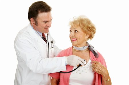 simsearch:400-04117274,k - Doctor using a stethoscope to listen to a senior woman's heart beat.  Isolated on white. Photographie de stock - Aubaine LD & Abonnement, Code: 400-04068309