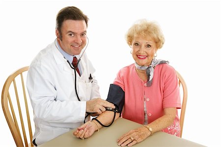 simsearch:400-04117274,k - Doctor taking a senior woman's blood pressure.  Isolated on white. Photographie de stock - Aubaine LD & Abonnement, Code: 400-04068313