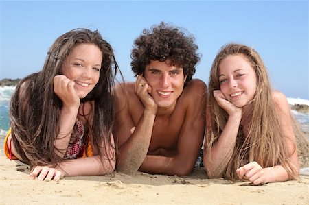 three happy teenagers having fun on the beach Stock Photo - Budget Royalty-Free & Subscription, Code: 400-04068950