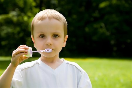 simsearch:400-04093413,k - The Boy Blowing Soap Bubbles Stock Photo - Budget Royalty-Free & Subscription, Code: 400-04069252