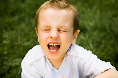 simsearch:400-04001701,k - Screaming Boy Sitting On The Grass Stock Photo - Budget Royalty-Free & Subscription, Code: 400-04069301