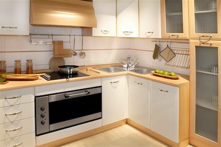 simsearch:659-06373243,k - Modern wooden kitchen counter with big cabinet Foto de stock - Super Valor sin royalties y Suscripción, Código: 400-04069529