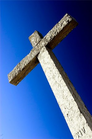 simsearch:400-05014919,k - Religious stone cross on a beautiful blue sky Photographie de stock - Aubaine LD & Abonnement, Code: 400-04060073
