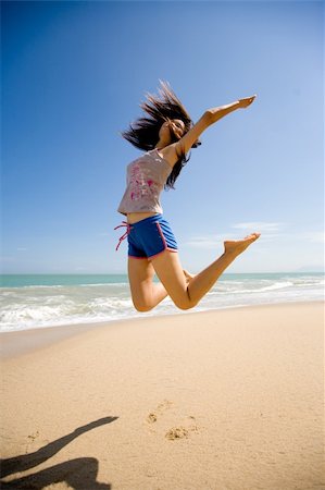 eyedear (artist) - young woman leaping joyfully in the air Stock Photo - Budget Royalty-Free & Subscription, Code: 400-04060355