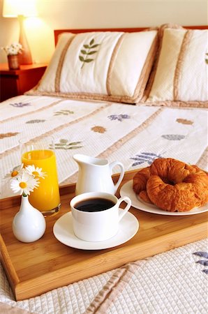 Tray with breakfast on a bed in a hotel room Stock Photo - Budget Royalty-Free & Subscription, Code: 400-04061269