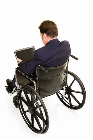simsearch:400-05021851,k - Disabled businessman in wheelchair working on computer.  Full body isolated on white. Foto de stock - Super Valor sin royalties y Suscripción, Código: 400-04061578