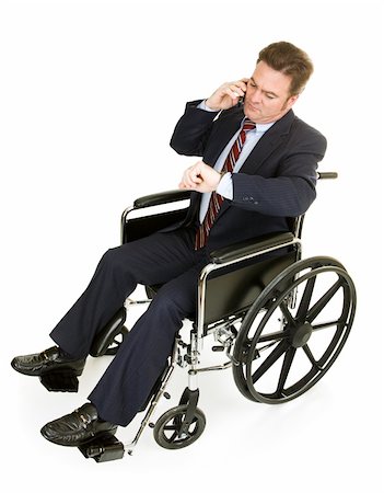 Businessman in wheelchair talking on his phone and checking the time.  Full Body isolated on white. Stock Photo - Budget Royalty-Free & Subscription, Code: 400-04061579