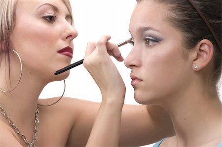 simsearch:400-05734913,k - Professional make up artist applying make up on a teen model Foto de stock - Royalty-Free Super Valor e Assinatura, Número: 400-04062113