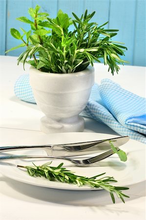 rosemary sprig - Fresh green herbs on a table in the kitchen Stock Photo - Budget Royalty-Free & Subscription, Code: 400-04062146