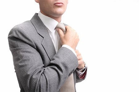 simsearch:400-03926780,k - young businessman fastening tie, isolated on white background Stockbilder - Microstock & Abonnement, Bildnummer: 400-04062653