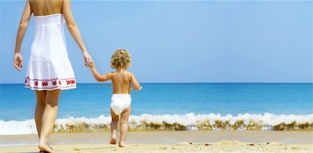 simsearch:400-04062793,k - Portrait of young mother with her baby  having fun on the beach Photographie de stock - Aubaine LD & Abonnement, Code: 400-04062792