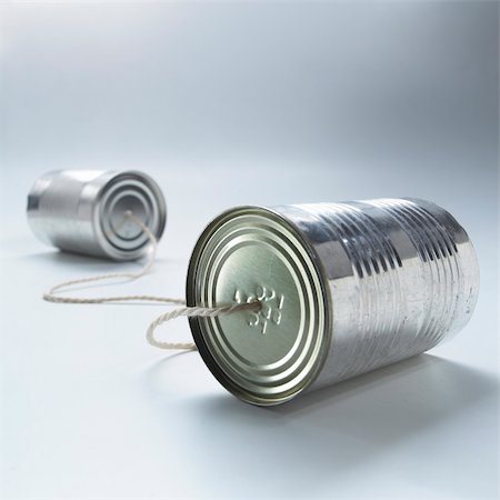two tin cans connected by a piece of string Stock Photo - Budget Royalty-Free & Subscription, Code: 400-04062845