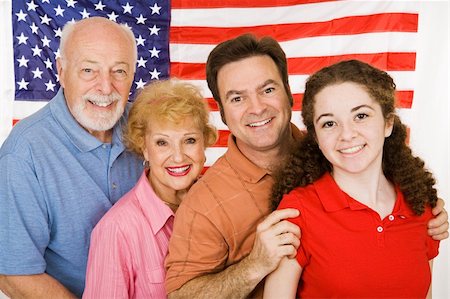 family portrait with flags - Grandparents, their adult child, and their granddaughter, posing in front of an American Flag. Stock Photo - Budget Royalty-Free & Subscription, Code: 400-04062862