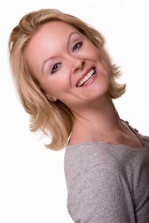 simsearch:400-04498992,k - Portrait of an attractive woman with blond hair and blue eyes with nice smile facial expression wearing a casual grey top over white Photographie de stock - Aubaine LD & Abonnement, Code: 400-04063027