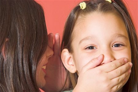 simsearch:400-03926791,k - One girl whispering a secret to another girl Stockbilder - Microstock & Abonnement, Bildnummer: 400-04063182