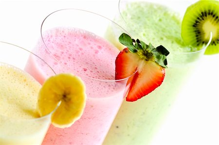 Assorted fruit smoothies close up on white background Stock Photo - Budget Royalty-Free & Subscription, Code: 400-04063387