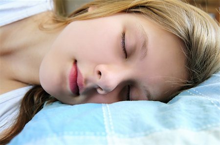 simsearch:400-04107830,k - Beautiful teenage girl sleeping in the morning Fotografie stock - Microstock e Abbonamento, Codice: 400-04063382