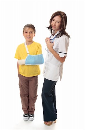 simsearch:400-09133906,k - Medical officer stands beside an injured young boy. Photographie de stock - Aubaine LD & Abonnement, Code: 400-04063666