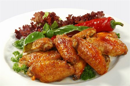 fried chicken wings in friture with red pepper Foto de stock - Super Valor sin royalties y Suscripción, Código: 400-04063747