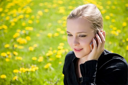 Young Woman Speaking By Phone On The Meadow Stock Photo - Budget Royalty-Free & Subscription, Code: 400-04063751
