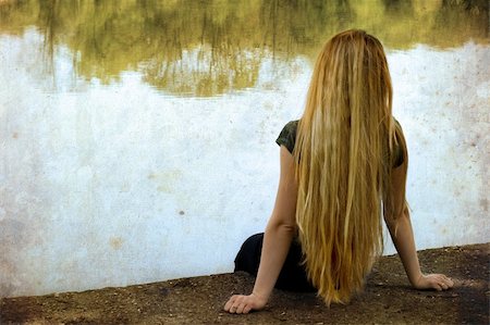 dundanim (artist) - Solitude: blond woman standing alone on lakeside Fotografie stock - Microstock e Abbonamento, Codice: 400-04063865