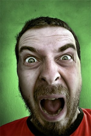 simsearch:400-05069351,k - Portrait of shouting shocked man with big and fearful eyes Stock Photo - Budget Royalty-Free & Subscription, Code: 400-04063861