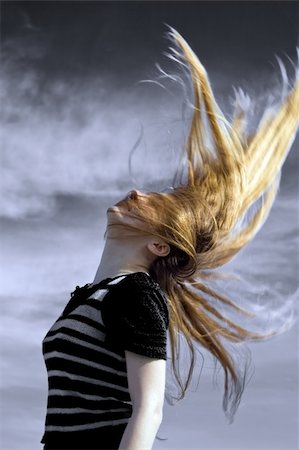 dundanim (artist) - Sexy young woman with her long blond hair in the air Fotografie stock - Microstock e Abbonamento, Codice: 400-04063863