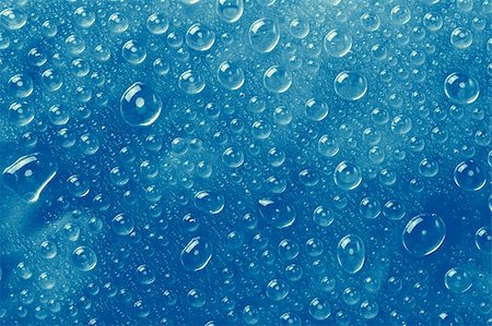 simsearch:400-04074032,k - Blue water drops on a glass surface. Stock Photo - Budget Royalty-Free & Subscription, Code: 400-04074030