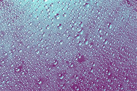 simsearch:400-04370982,k - Purple-blue water drops on a glass surface. Photographie de stock - Aubaine LD & Abonnement, Code: 400-04074032