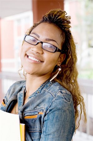 happy young female african american college student Stock Photo - Budget Royalty-Free & Subscription, Code: 400-04075274