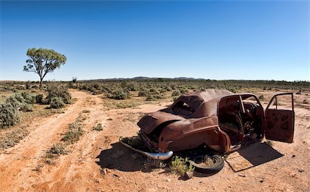 great image of an old car rusting away in the desert Stock Photo - Budget Royalty-Free & Subscription, Code: 400-04076089